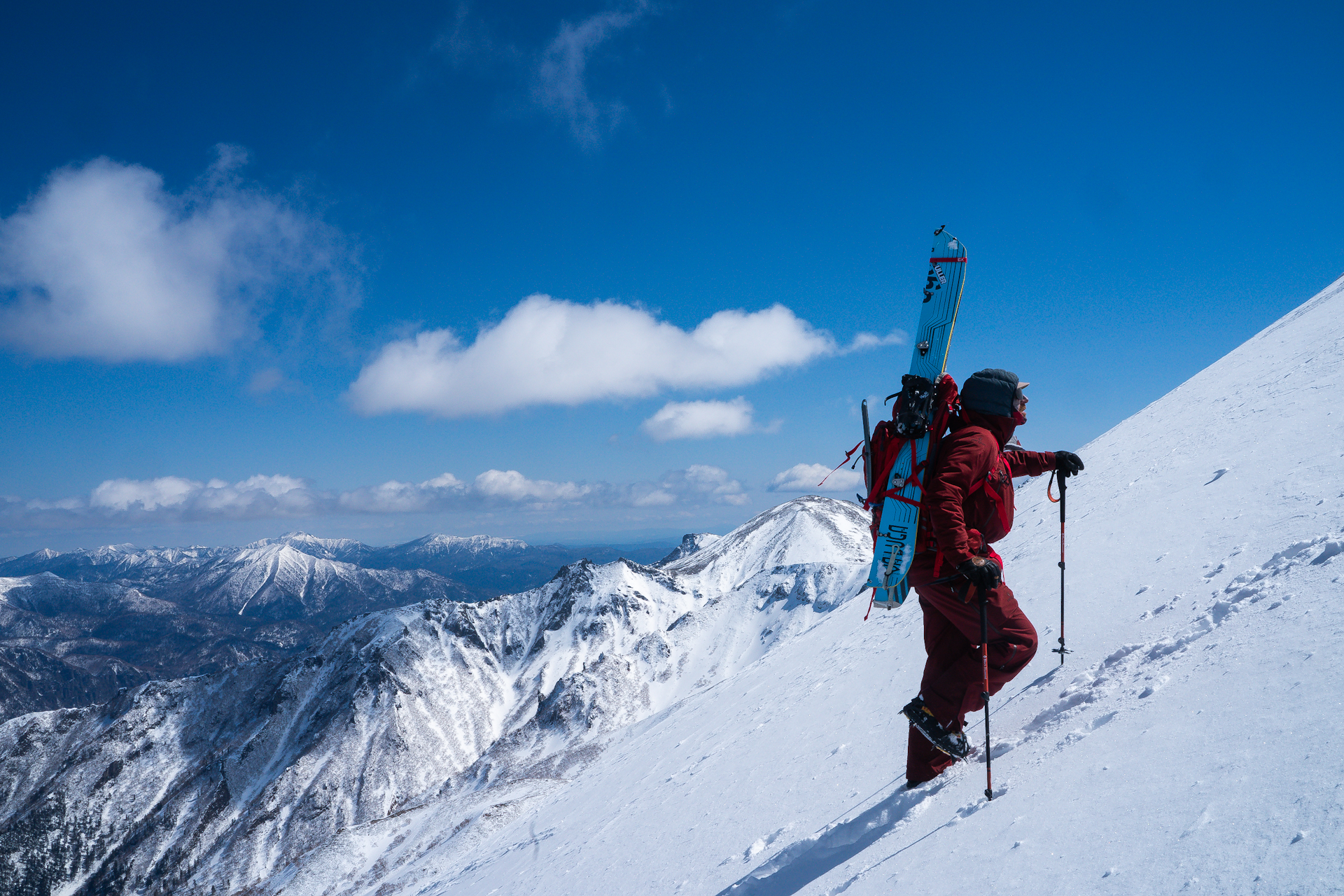 climber, splitboard, crampons, poles, waterproof jacket and pants, sunglasses, snowboard boots